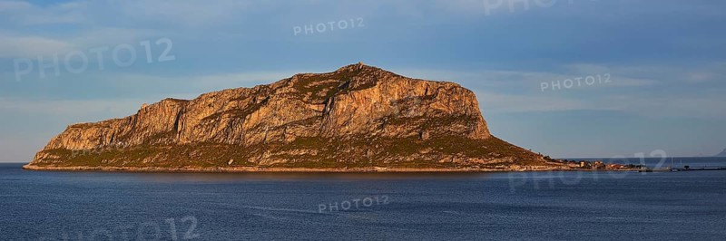 Rocky island in calm water at sunset with blue sky, Monemvasia, Monemvassia, Malvasy, Byzantine small town, rocky island, fortress, Laconia, Peloponnese, peninsula, Greece