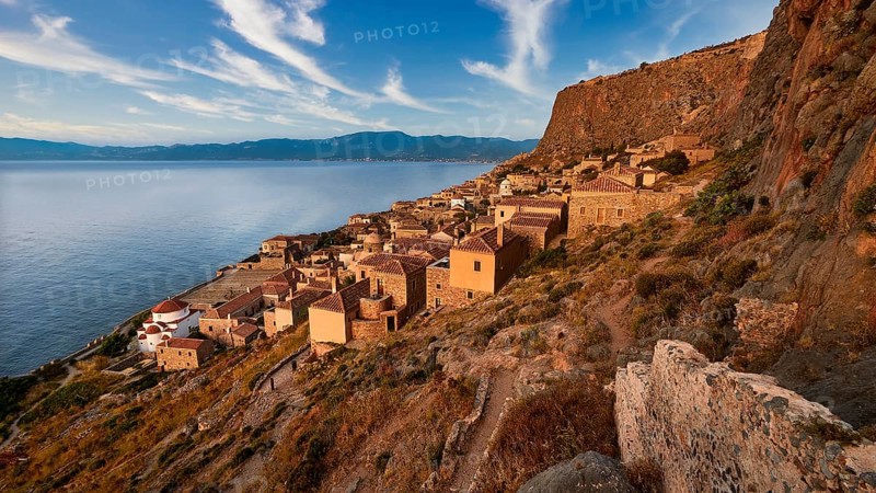 Sky replaced, traditional coastal village with stone houses on a steep rocky coast, Monemvasia, Monemvassia, Malvasy, small Byzantine town, rocky island, fortress, Laconia, Peloponnese, peninsula, Greece