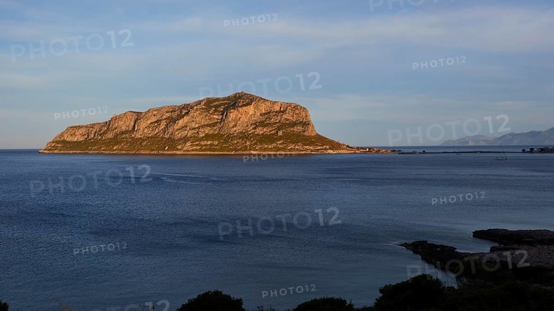 Flat rocky island in the calm blue sea under a clear sky, Monemvasia, Monemvassia, Malvasy, Byzantine small town, rocky island, fortress, Laconia, Peloponnese, peninsula, Greece