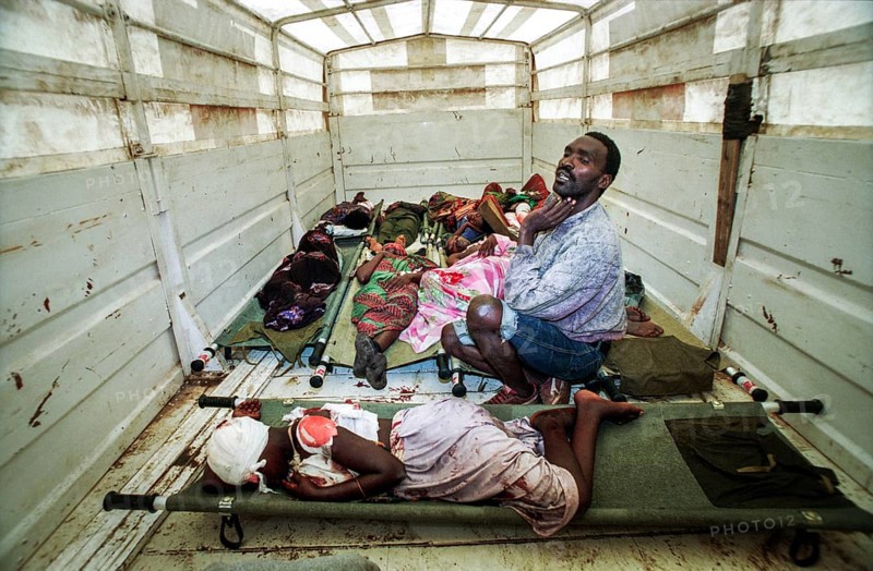 RWA Rwanda Kigali Injured Tutsi refugees who fled to the sports stadium are waiting for treatment in a Red Cross truck. The stadium had previously been attacked with mortar shells by Hutu rebels. RWA Rwanda Kigali Injured Tutsi Refugees Who Escaped the Massacre Waiting in the Back of a Red Cross Truck for Further Treatment They Were Attacked by Hutu Rebels as They Were Hiding in Kigali's Main Sport Stadium