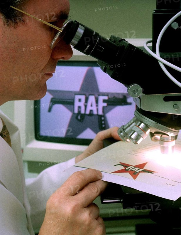DEU, Wiesbaden, 01.09.1994 -- A BKA official examining an RAF letter for authenticity. -- A police expert proofs a letter of the Red Army Fraction, a German terroristic group, in a laboratory in Wiesbaden. -- Â© Karsten Thielker