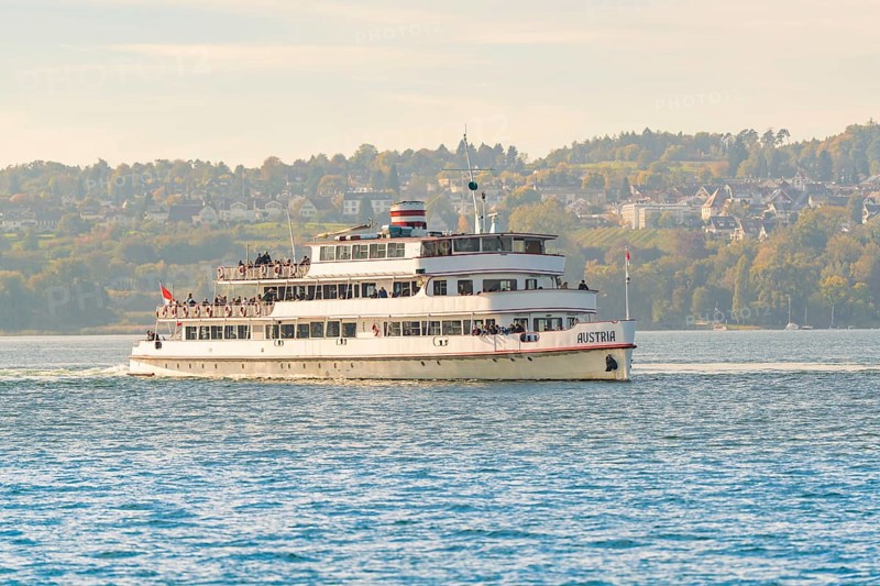 Large passenger ship on a lake with city and nature in the background, boat trip, Lake Constance, Germany