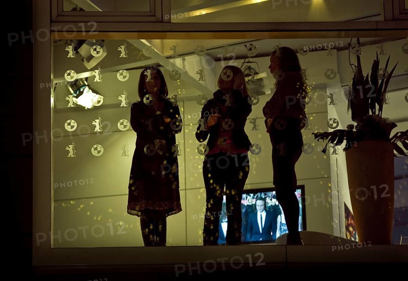 DEU, Germany, Berlin BMW Lounge employees watch the reception in front of the Berlinale Palace Germany Berlin Hostesses watch the red carpet in front of the Berlinale Palace