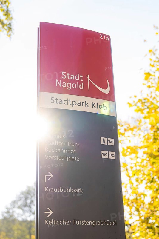 Signpost in Nagold City Park in autumn sunlight, Nagold, Black Forest, Germany