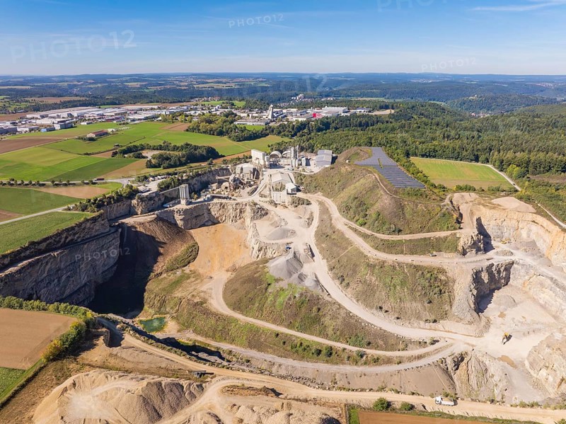A large quarry with surrounding fields and forests from the air, Nagold, Black Forest, Germany