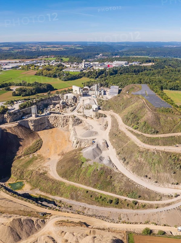 An industrial complex in a quarry in a rural area with fields, Nagold, Black Forest, Germany