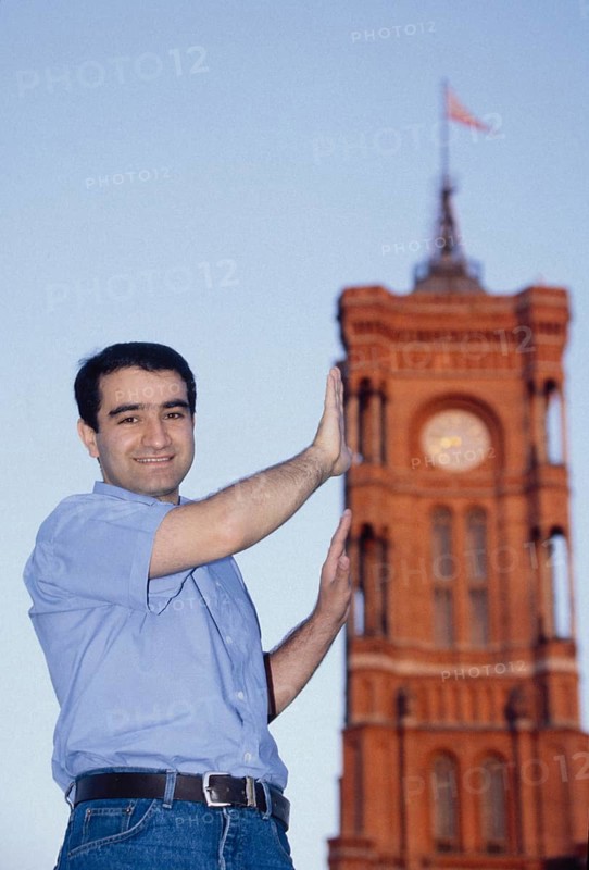 DEU Germany Germany Berlin Portrait of Özcan Mutlu, MdB (Alliance 90/The Greens) - Migration Policy Section, Member of the Federal Executive Committee of ImmiGrün e.V. and coordinator of Christian Ströbele's election campaign in front of the Red Town Hall