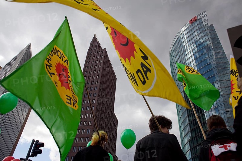 Germany Berlin Anti-nuclear power demonstration in Berlin Mitte. Demonstrators with flags in front of the start of the train. Germany Berlin protest rally against nuclear power plants. Protesters carry flags at the start up of the rally