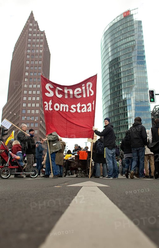 Germany Berlin Anti-nuclear power demonstration in Berlin Mitte. Demonstrators holding banners with the words 'Shit nuclear state. ' Germany Berlin protest rally against nuclear power plants. Demonstrators with a Banner Read '
