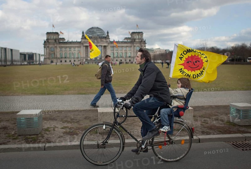 Germany Berlin Anti-nuclear power demonstration in Berlin Mitte. Demonstrators pass the Reichstag Germany Berlin Protest Rally against Nuclear Power Plants. Protesters in front of the Reichstag, the German Parliament