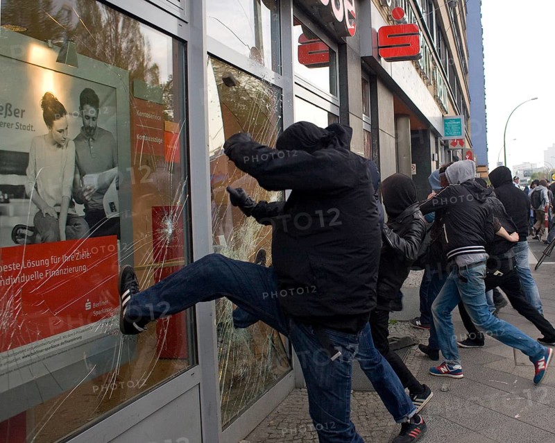 GERMANY Demonstrators enter a window of a savings bank branch at the May 1 rally. Germany Berlin Demonstrators Smashing a Bank During the May Day Protest