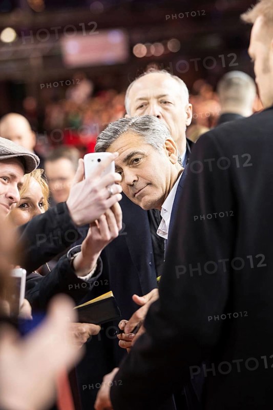 DEU Germany Germany Berlin 64th Berlinale, the international film festival in the German capital. The director of the films 'Monuments Men' George Clooney has himself photographed by a fan with his smartphone