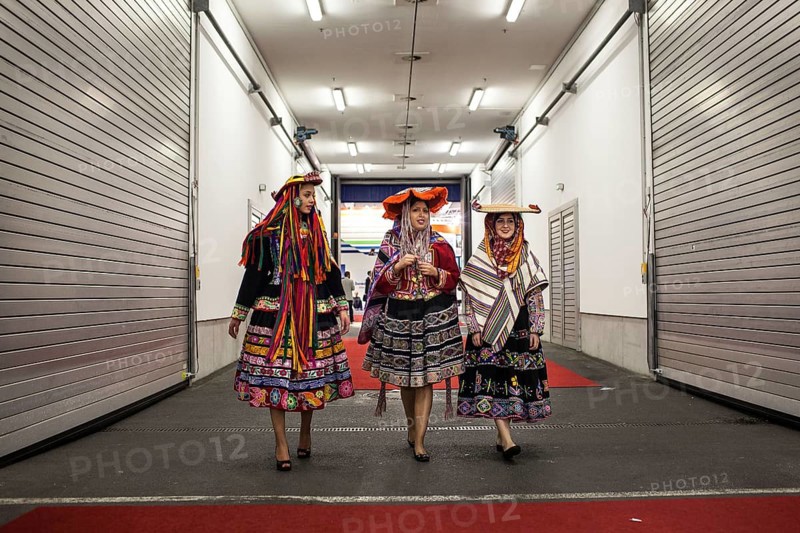 DEU Germany Germany Berlin International Tourism Exchange ITB. South American hostesses walk through a crossing between two exhibition halls