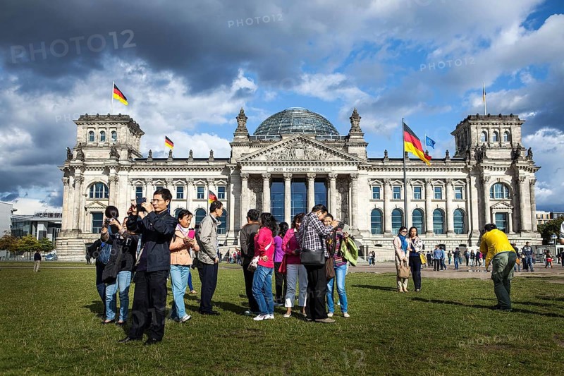 DEU Germany Germany Berlin Asian tourists take pictures of themselves in front of the Reichstag