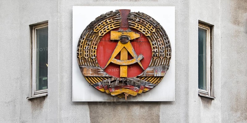 Old building of the Wall Museum — Museum Haus am Checkpoint Charlie with old GDR coat of arms, Friedrichstraße, Kreuzberg, Berlin, Germany