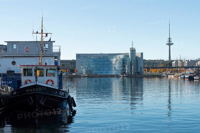Harbor, Baltic Sea, city view Kiel, Kiel Fjord, shipping traffic, architecture, glass Hörn, wharf, pier, Sartori Berger Speicher, red brick building, telecommunications tower or television tower, Germany flag, sunshine, blue sky, Schleswig-Holstein, Germany