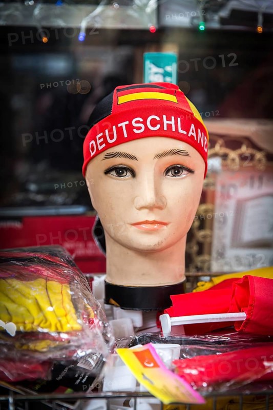 DEU Germany Germany Berlin doll with euro 2016 fan item in a shop window in Neukölln