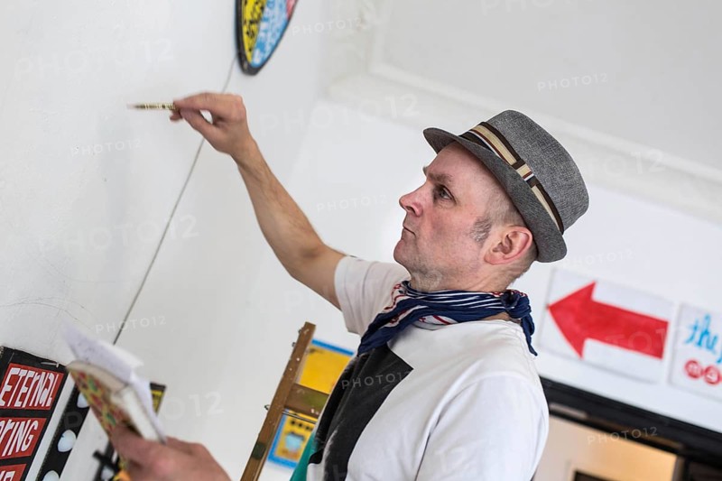 DEU Germany Germany Berlin The artist Jim Avignon setting up an exhibition at the 'Retram' gallery in Berlin-Neukölln