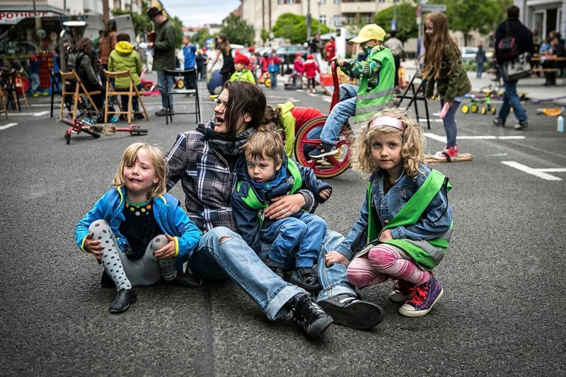 DEU Germany Germany Berlin Children play on Gudvanger Straße, which has been declared the city's first temporary play street. Parents, daycare and a school had worked to temporarily close the road on Oberen Prenzlauer Berg to road traffic