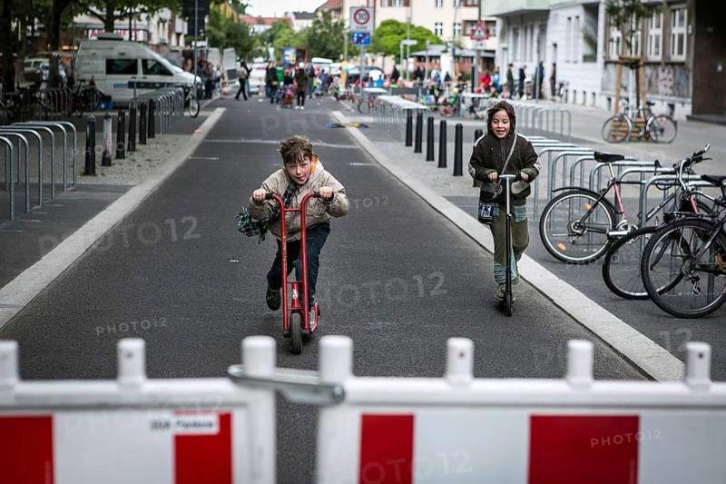 DEU Germany Germany Berlin Children play on Gudvanger Straße, which has been declared the city's first temporary play street. Parents, daycare and a school had worked to temporarily close the road on Oberen Prenzlauer Berg to road traffic