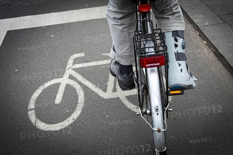 DEU Germany Germany Berlin Cyclists with splints on a bicycle path in Mitte