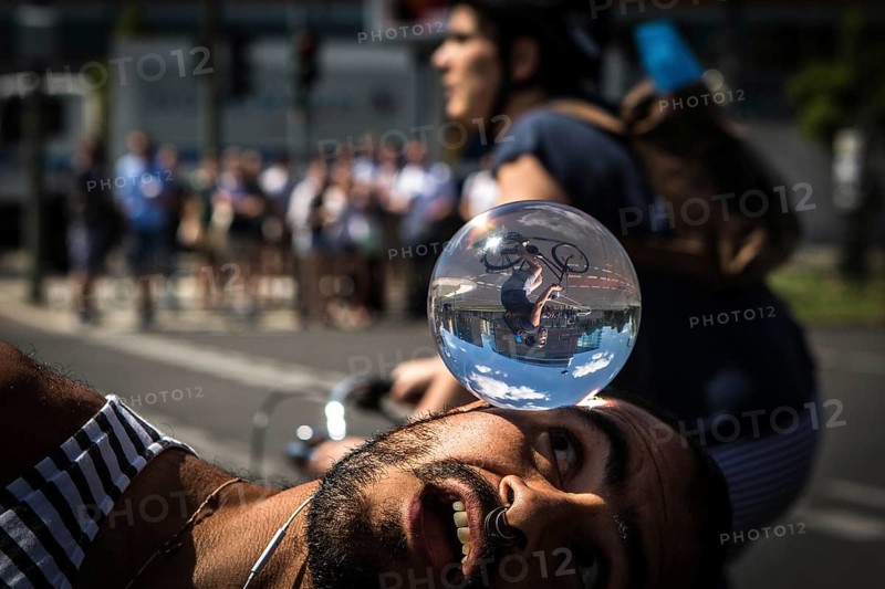 DEU Germany Germany Berlin Juggler with crystal ball works at the intersection opposite the CDU federal party headquarters