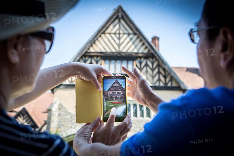 DEU Germany Germany Potsdam Tourists photograph the courtyard of the Cecilienhof with the Red Star