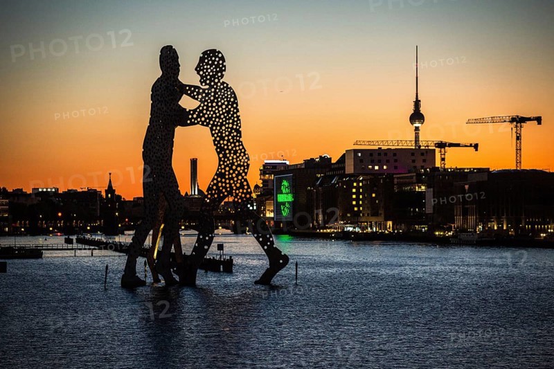 DEU Germany Germany Berlin View over Osthafen across the Spree towards Alex at sunset