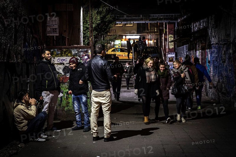 DEU Germany Germany Berlin scene on the RAW site in Berlin-Friedrichsain. Entrance area with men and arriving woman