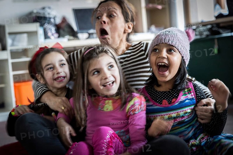 DEU Germany Germany Berlin An animation team entertains refugee children in an asylum center in Berlin