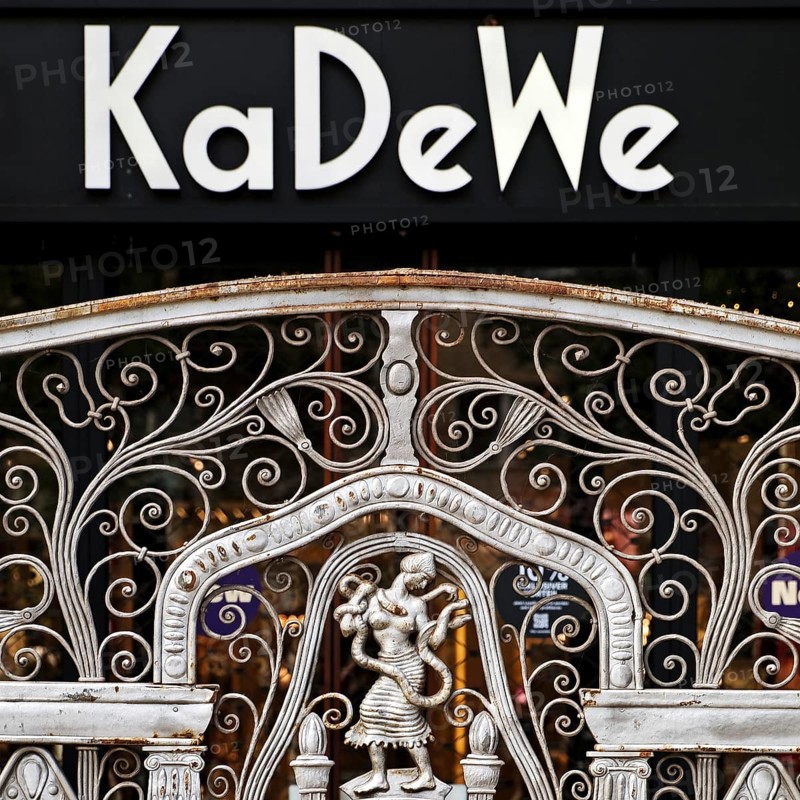 KaDeWe logo, Kaufhaus des Westens, with old forged grid in front of the entrance when the shop is closed, Charlottenburg, Berlin, Germany