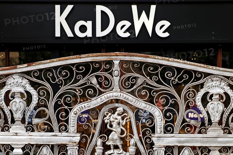 KaDeWe logo, Kaufhaus des Westens, with old forged grid in front of the entrance when the shop is closed, Charlottenburg, Berlin, Germany
