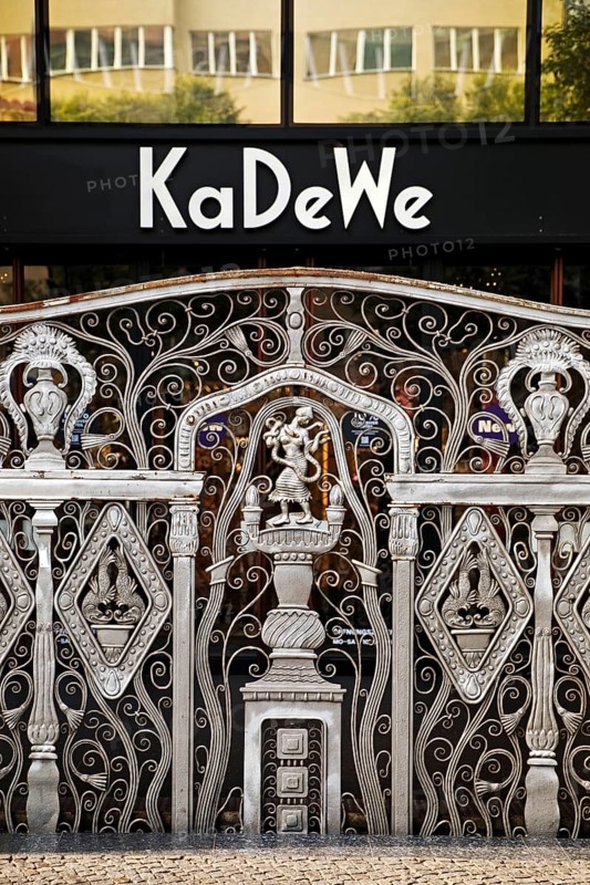 KaDeWe logo, Kaufhaus des Westens, with old forged grid in front of the entrance when the shop is closed, Charlottenburg, Berlin, Germany