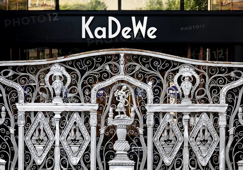 KaDeWe logo, Kaufhaus des Westens, with old forged grid in front of the entrance when the shop is closed, Charlottenburg, Berlin, Germany