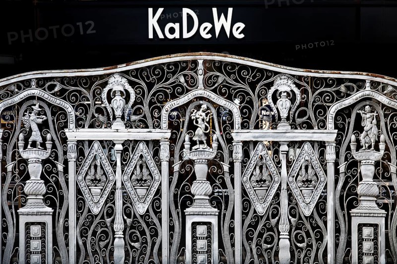 KaDeWe logo, Kaufhaus des Westens, with old forged grid in front of the entrance when the shop is closed, Charlottenburg, Berlin, Germany