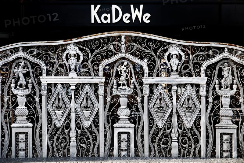 KaDeWe logo, Kaufhaus des Westens, with old forged grid in front of the entrance when the shop is closed, Charlottenburg, Berlin, Germany