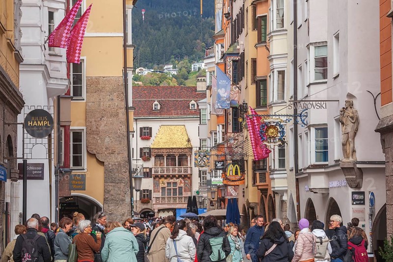 Golden roof, lots of people and historic houses in Herzog-Friedrich-Straße, Altstadt, Innsbruck, Tyrol, Austria