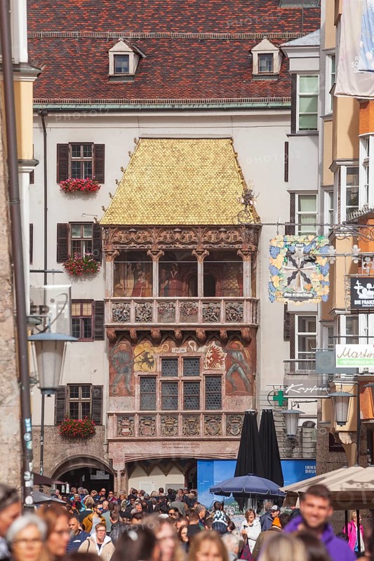 Golden roof, lots of people and historic houses in Herzog-Friedrich-Straße, Altstadt, Innsbruck, Tyrol, Austria