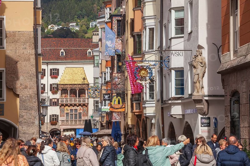 Golden roof, lots of people and historic houses in Herzog-Friedrich-Straße, Altstadt, Innsbruck, Tyrol, Austria