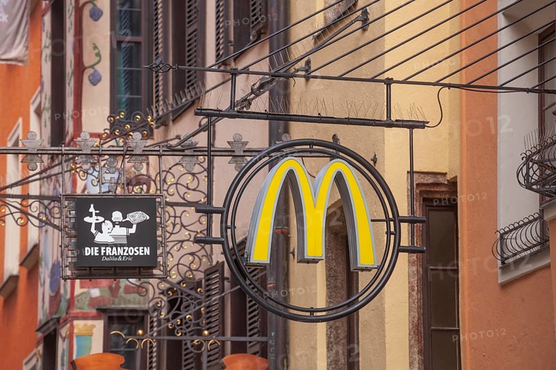 McDonald's hanging sign in Herzog-Friedrich-Straße, Altstadt, Innsbruck, Tyrol, Austria