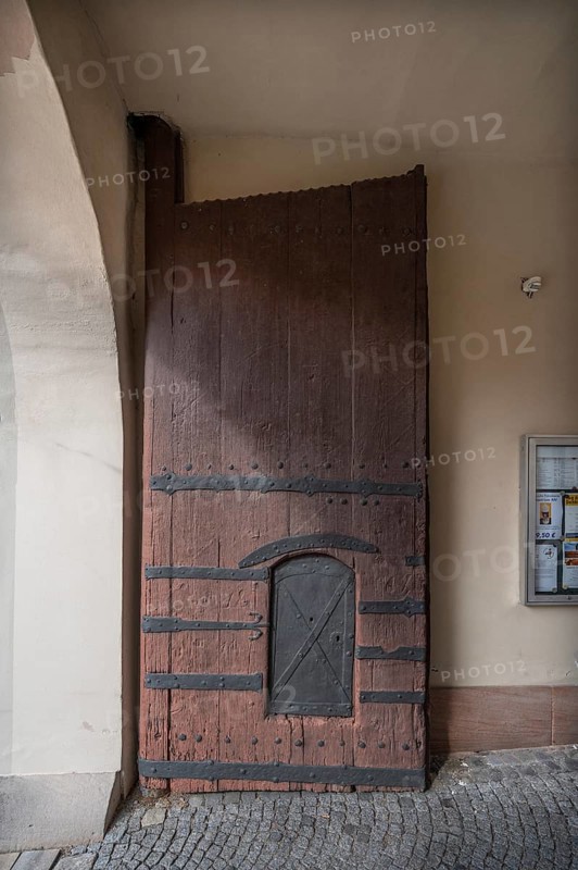 Left side of the wooden gate with manhole at the entrance to the fortified church, around 1500, Hannberg, Middle Franconia, Bavaria, Germany