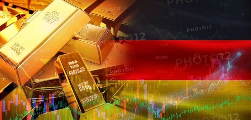 Gold bars stacked on German flag. Germany gold reserves, Concept