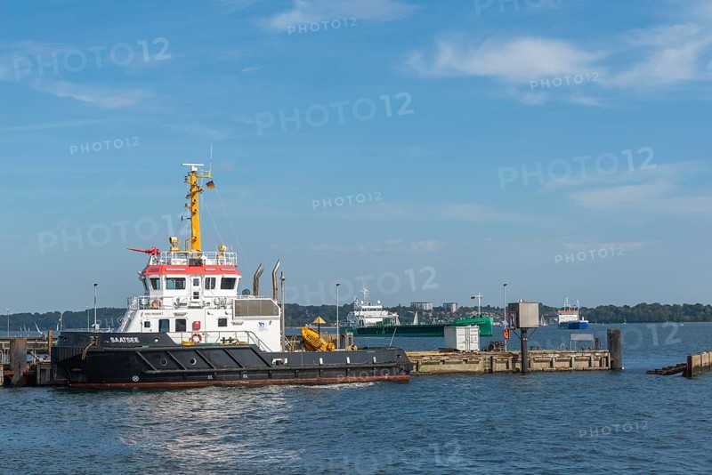 Saatsee in the harbor, multi-purpose ship of the Kiel Canal Waterways and Shipping Authority. Ships waiting for canal entrance, Baltic Sea, Kiel Fjord, Kiel, baluer sky, sunshine, Holtenau district, Schleswig-Holstein, Germany