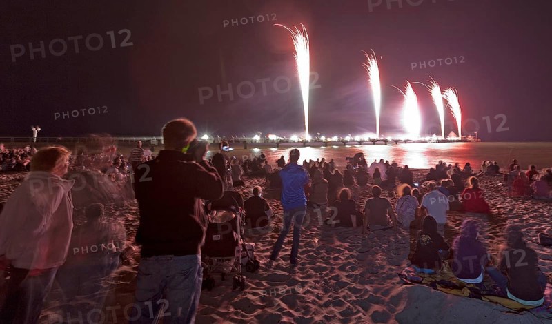 Baltic Sea in flames at Grömitz pier, fireworks, highlight of the season, end of the season, beach, spectators, beach chairs at night, shower of sparks, Baltic Sea resort, tourist attraction, Grömitz, Baltic Sea, Schleswig-Holstein, Germany, Europe, aerial photo, birds-eyes view, aerial photography, aerial photography, overview, overview, bird's-eye view