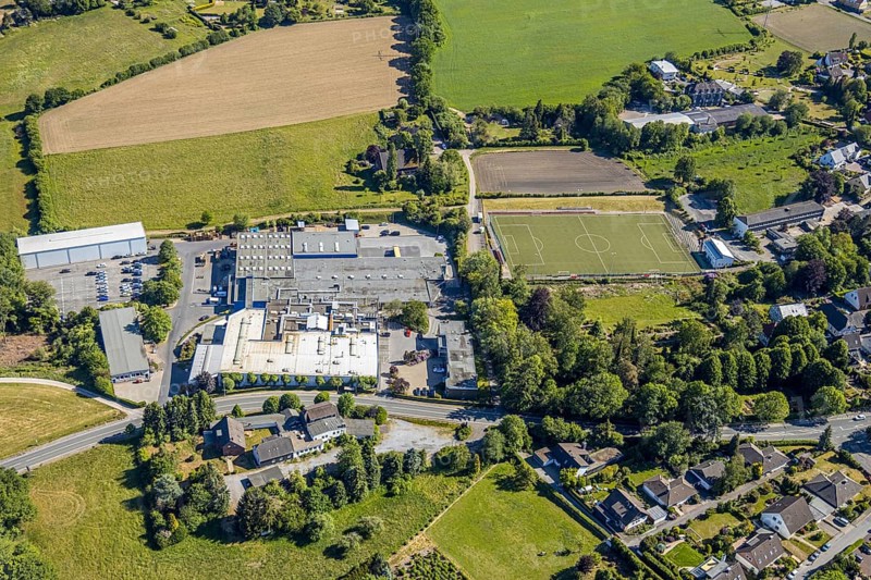 Aerial view, sports ground VfL Gennebreck 1923, Wicke GmbH, Herzkamp, Sprockhövel, Ruhr area, North Rhine-Westphalia, Germany, business-to-business service, DE, Ennepe-Ruhr district, Europe, commercial enterprises, commercial area, commercial site, commercial use, industrial area, industrial site, aerial photograph, aerial photography, aerial photography, overview, bird's-eye view, bird's-eye view, industrial wheels, overview
