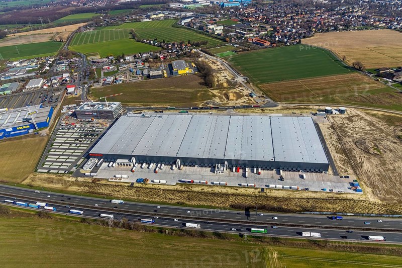 Aerial view, new building Woolworth headquarters and logistics centre, commercial area Unna Kamen, Unna, Ruhr area, North Rhine-Westphalia, Germany, d 0.188958 0.190221, EN, Europe, commercial enterprises, commercial area, commercial area, commercial park, commercial location, commercial use, freight traffic, industrial area, industrial location, logistics, logistics centre, aerial view, aerial photography, aerial photography, overview, bird's-eye view, overview