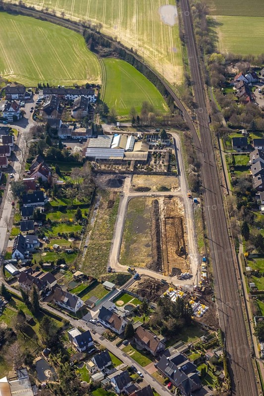 Aerial view, Drücke Garten-Zentrum Unna, construction area residential buildings, former sports field, Steinstraße, Unna, Ruhr area, North Rhine-Westphalia, Germany, railway tracks, construction work, construction area, building site, building plots, construction project, construction site, DE, development, Europe, property tax, real estate, capacity requirements, aerial view, aerial photography, aerial photography, new construction, overview, bird's-eye view, housing estate, housing and living, residential area, residential buildings, residential quality, residential neighbourhood, housing estate, birds-eyes view, overview
