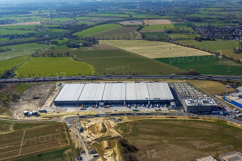Aerial view, new Woolworth headquarters and logistics centre, Unna Kamen business park, Unna, Ruhr area, North Rhine-Westphalia, Germany, A1 motorway, DE, Europe, commercial enterprises, commercial area, business park, commercial location, commercial use, freight traffic, industrial area, industrial location, logistics, logistics centre, aerial view, aerial photography, aerial photography, overview, bird's-eye view, meadows and fields, bird's-eye view, overview