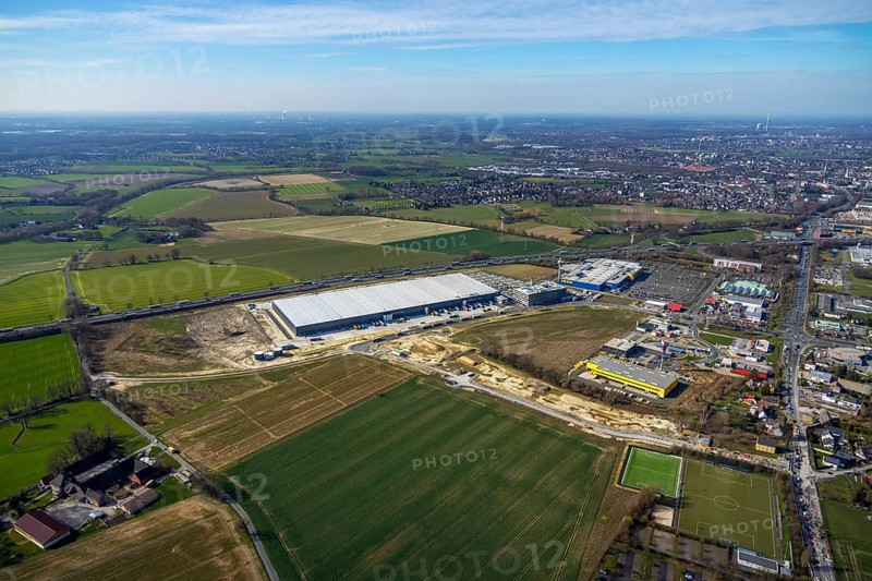 Aerial view, new Woolworth headquarters and logistics centre, commercial area Unna Kamen, Ikea, Unna, Ruhr area, North Rhine-Westphalia, Germany, A1 motorway, DE, Europe, commercial enterprises, commercial area, commercial park, commercial location, commercial use, freight traffic, industrial area, industrial location, logistics, logistics centre, aerial view, aerial photography, aerial photography, overview, bird's-eye view, meadows and fields, birds-eyes view, overview