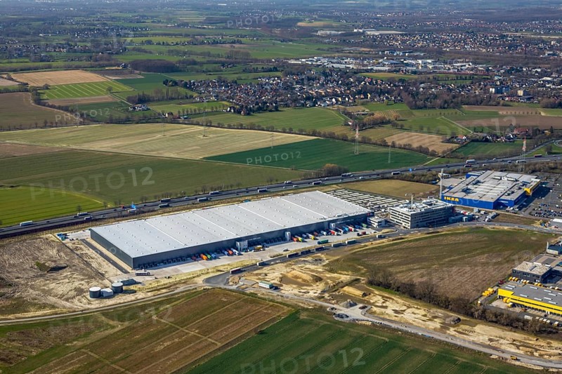 Aerial view, new Woolworth headquarters and logistics centre, commercial area Unna Kamen, Ikea, Unna, Ruhr area, North Rhine-Westphalia, Germany, A1 motorway, DE, Europe, commercial enterprises, commercial area, commercial park, commercial location, commercial use, freight traffic, industrial area, industrial location, logistics, logistics centre, aerial view, aerial photography, aerial photography, overview, bird's-eye view, meadows and fields, birds-eyes view, overview